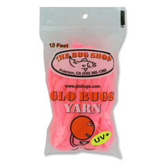 A clear plastic bag of pink gloved yarn from The Bug Shop, featuring a white and orange logo with a fish graphic and a green UV+ sticker on the front.